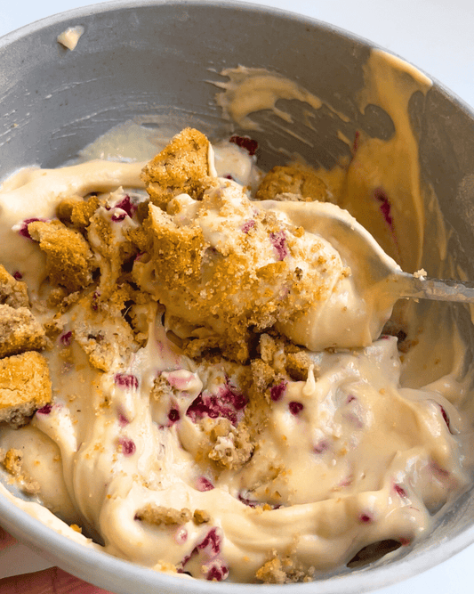cheesecake protein yogurt bowl up close in a grey bowl