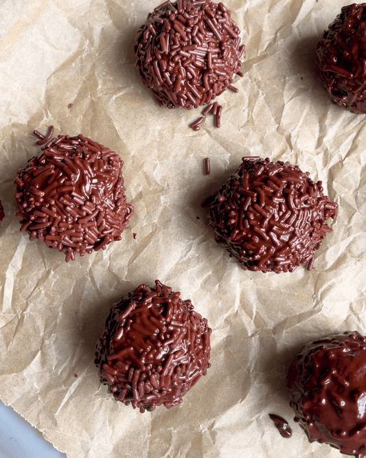 Chocolate Protein Truffles on a parchment paper