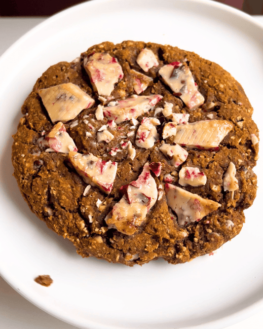 gingerbread white chocolate cookie on a white plate