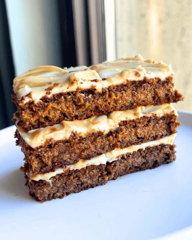 gingerbread cake with cream cheese frosting on a plate