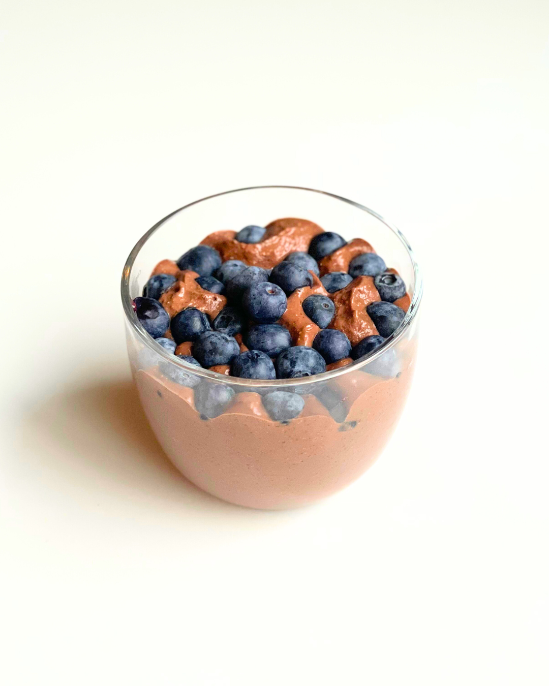 chocolate chia seed pudding in a glass meal prep container