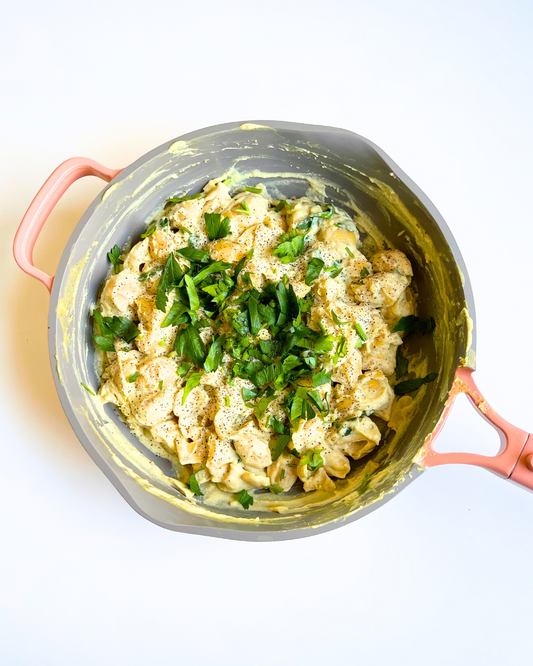creamy white bean pasta in a skillet