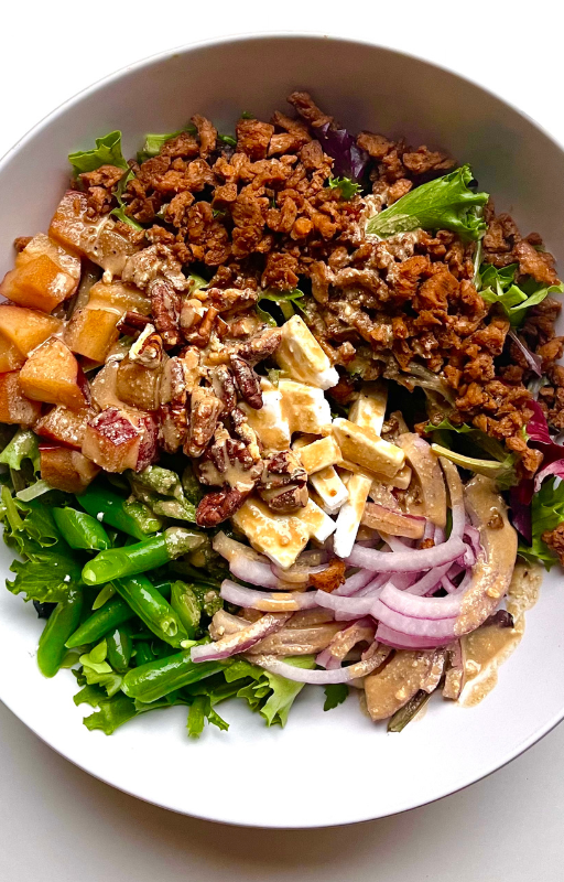 Balsamic Salad with Vegan Bacon on a white plate with a white background from the high protein vegan lunch recipes ebook