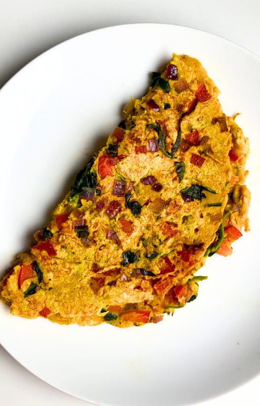 Vegan chickpea omelette on a white plate