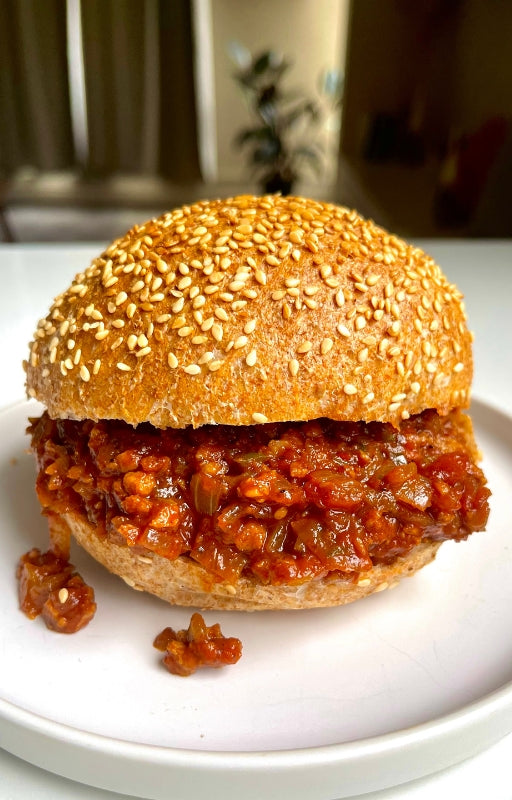 Vegan sloppy joe sandwich on a white plate