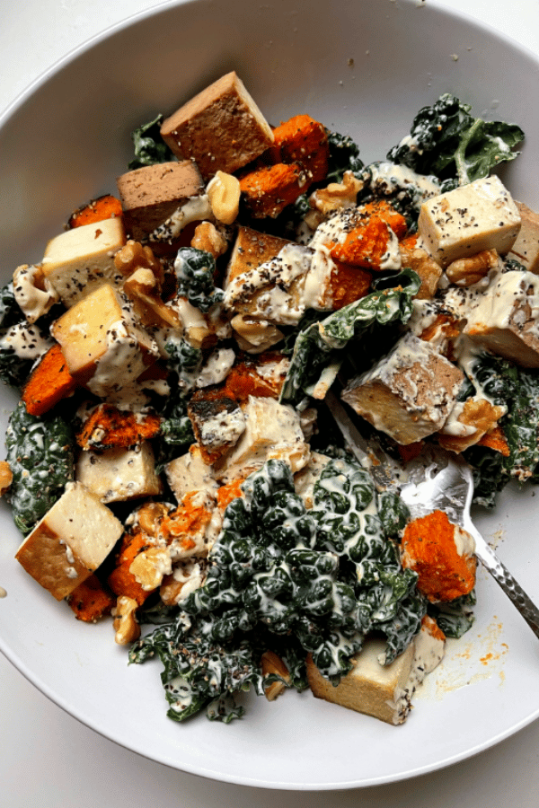 vegan caesar salad in a white bowl