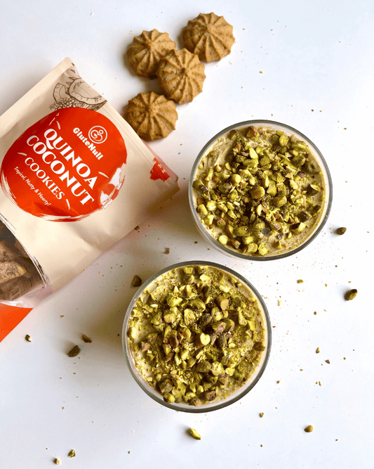protein yogurt pistachio cheesecake flavour in glass jars with an open bag of cookies