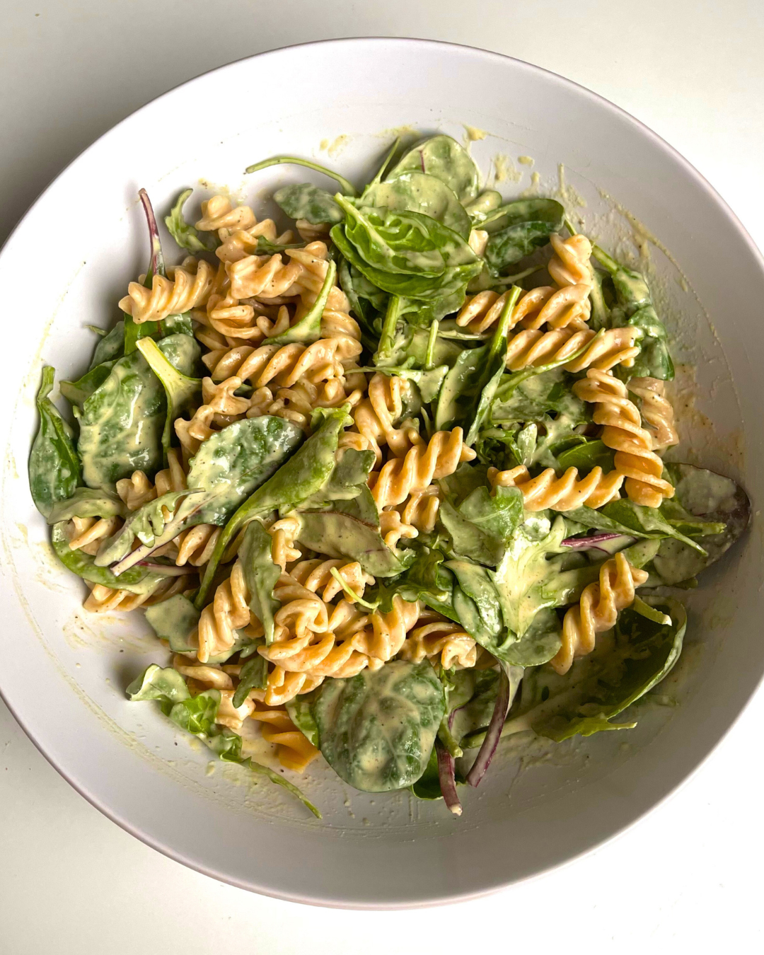 caesar pasta salad in a bowl