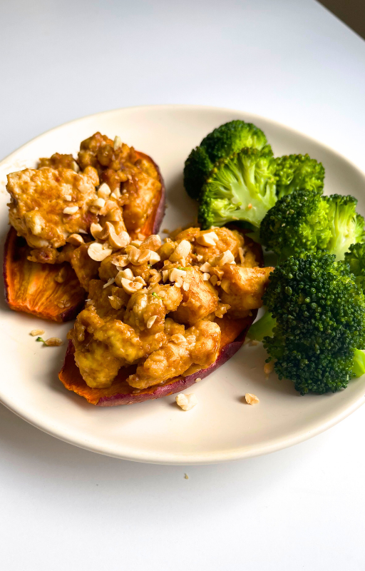 Baked yams with tofu on top and a side of broccoli