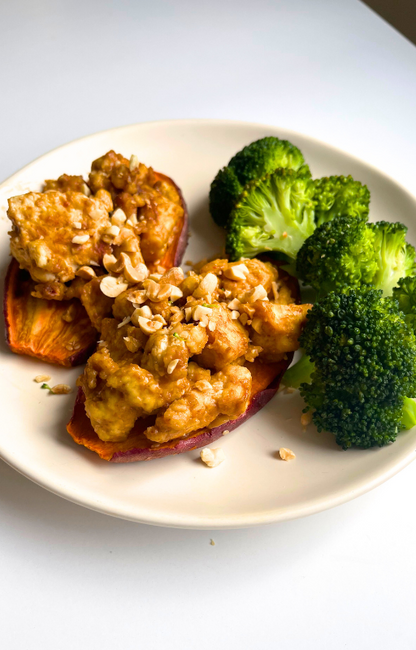 Baked yams with tofu on top and a side of broccoli