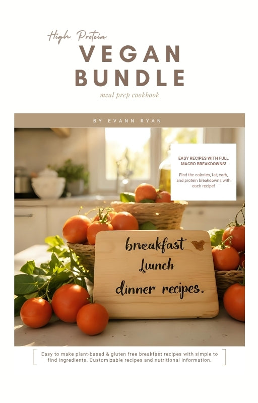 Vegan meal prep cookbook with oranges and a cutting board in a kitchen setting