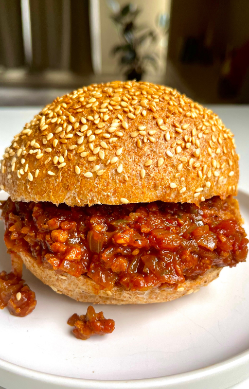 Vegan sloppy joe sandwich on a white plate