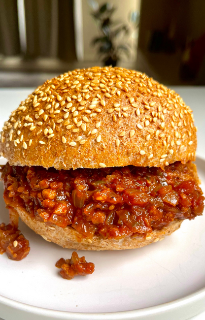Vegan sloppy joe sandwich on a white plate